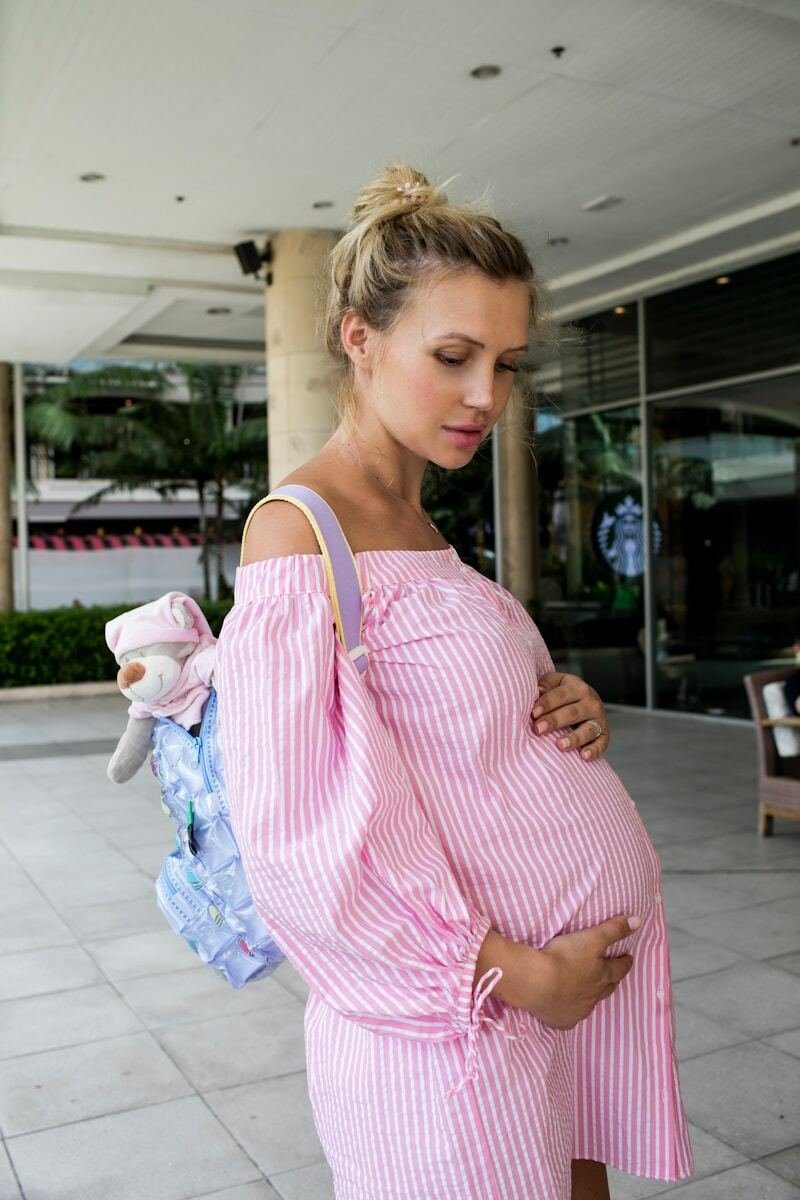 a person holding a stuffed animal