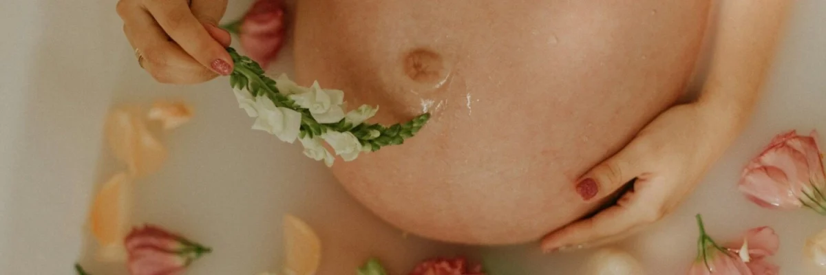 woman with pink and white flowers on her breast